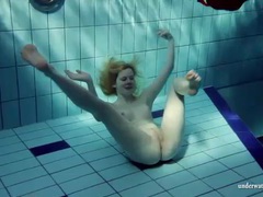 7X3.net presents: Blonde goes for a swim and strips