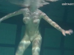 7X3.net presents: Naked brunette with big tits swims solo