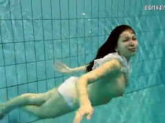 7X3.net presents: Girl in white panties swims in pool