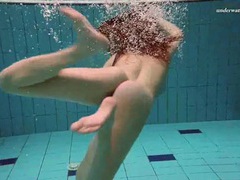 7X3.net presents: Underwater with a busty naked babe as she swims