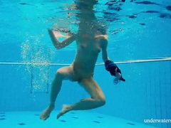 7X3.net presents: Teen strips off her dress as she goes for a swim