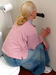 7X3.net presents: Blonde girl Jamie sits on the toilet and blows a black gloryhole dong
